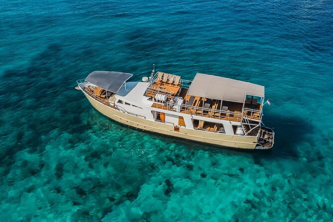 Blue Lagoon and 3 Island Boat Tour with Food and Drinks Included - Šolta first: Nečujam and the wreck-ship swim moment