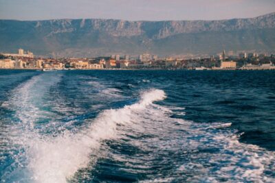 From Omis: Blue Cave & 5 Island Speedboat Tour - Blue Cave on Biševo: flickering light, Monk Seal Cave, and weather rules