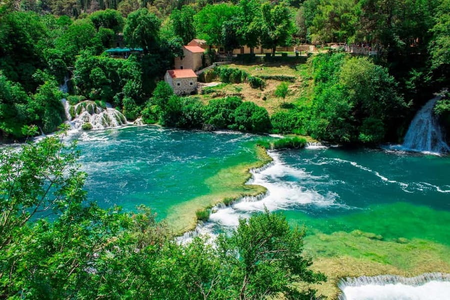 From Split: Krka Waterfalls Tour with Boat Ride & Swimming - Skradin in 1.5 hours: cobblestones, beach time, and easy food choices