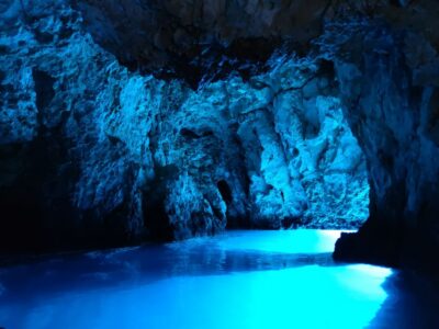 From Split: Luxury Cabin Boat Tour to The Blue Cave and Hvar - Blue Cave Entrance: Duck Under, See the Light, Then Move On