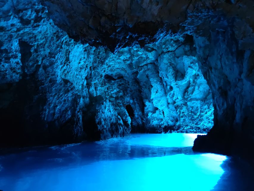 From Split: Luxury Cabin Boat Tour to The Blue Cave and Hvar - Blue Cave Entrance: Duck Under, See the Light, Then Move On