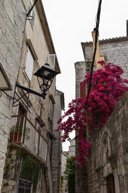 Split: Trogir Open Top Bus Trip + Free Split Walking Tour - Entering Trogir Old Town: narrow streets, bigger meaning
